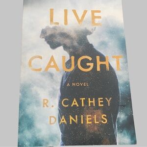 Live Caught by R. Cathey Daniels - Blue and Gold Cover Novel